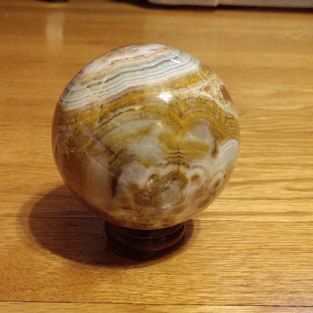 Marble (various crystal inclusions) orb.